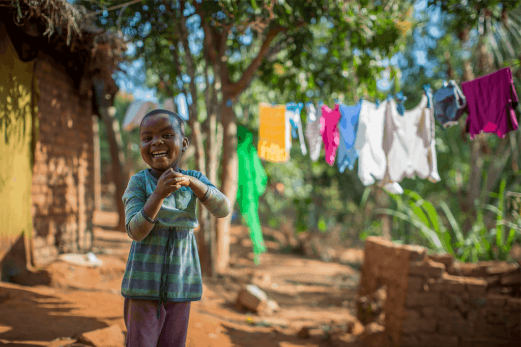 Little boy clapping his hands together in Rwanda